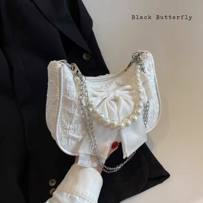 Túi đeo chéo đính nơ vải sần Butterfly