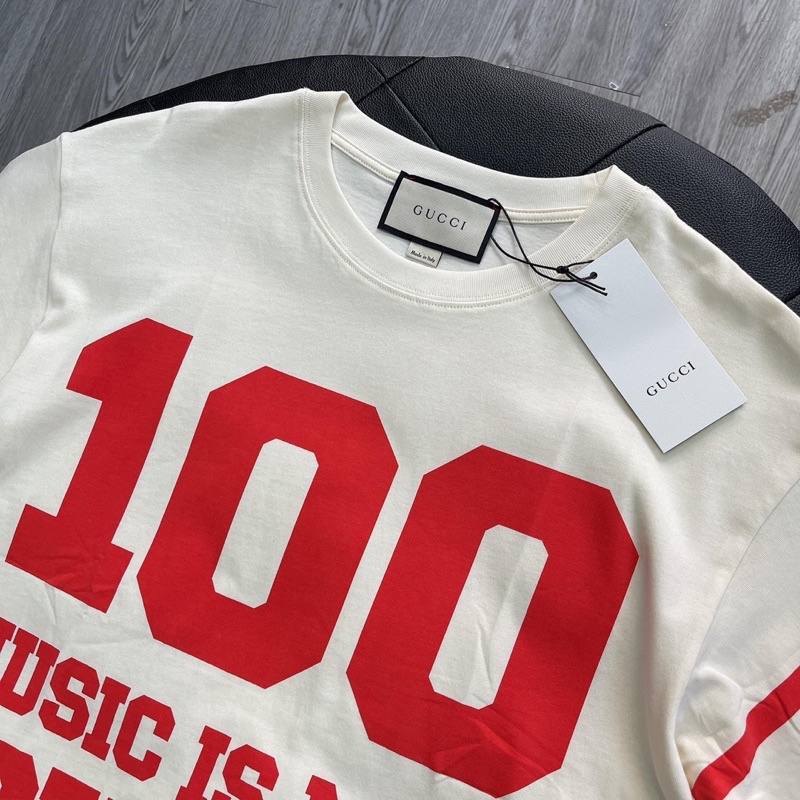 Áo Tee Gu*cci 100 Music Is Mine Màu Off-White