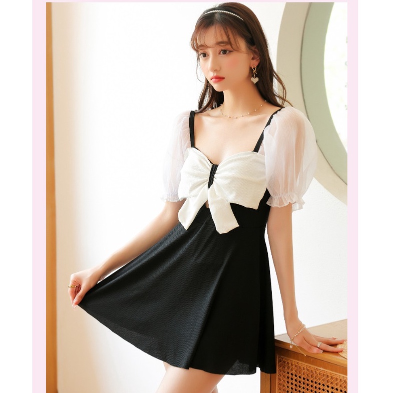 Bộ đồ bơi nữ liền thân dáng váy nơ xinh tay phối voan trắng