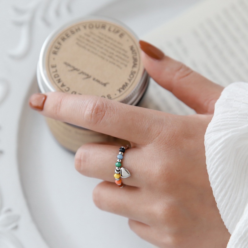 Nhẫn nữ titan kiểu xâu chuỗi bi tròn và thủy tinh màu sắc mặt cười trái tim không gỉ WE2209