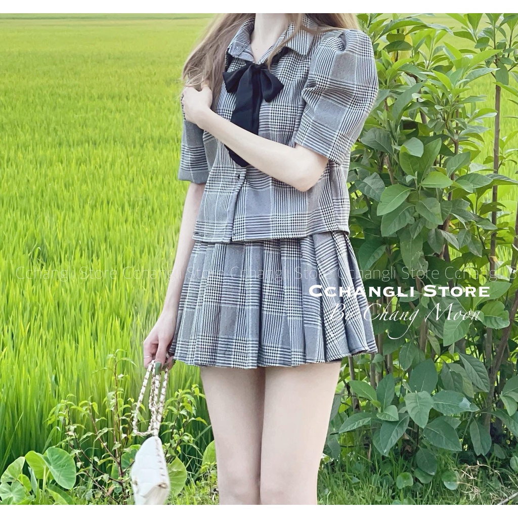 Set vest nơ kẻ chân váy xếp li xám  TL349