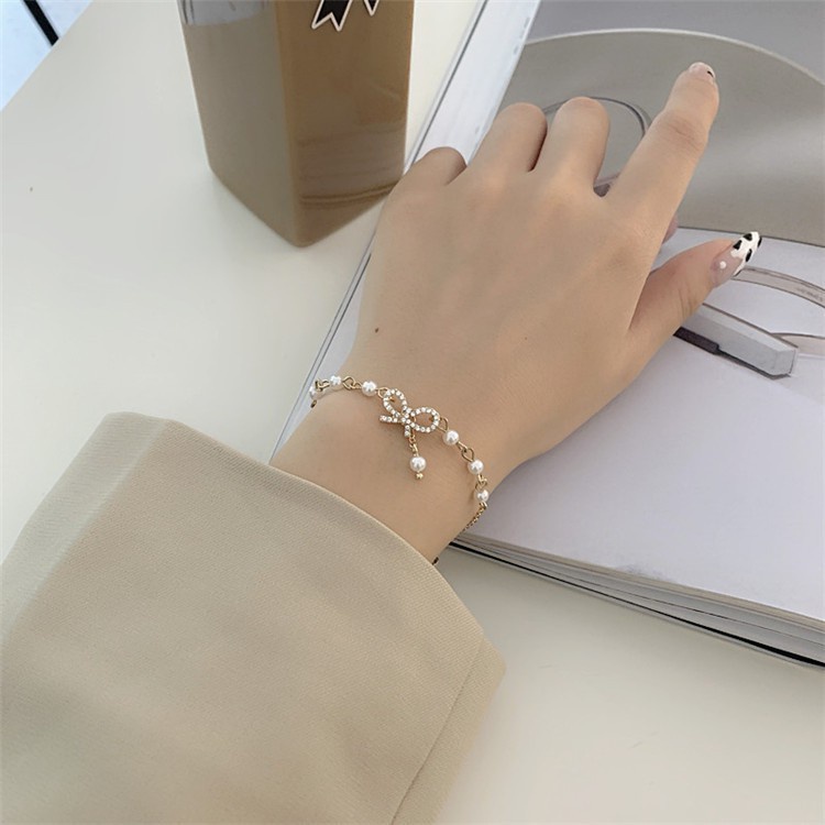 Vòng Tay Mạ Vàng Hình Nơ Đính Ngọc Trai Giả Xinh Xắn Cho Nữ