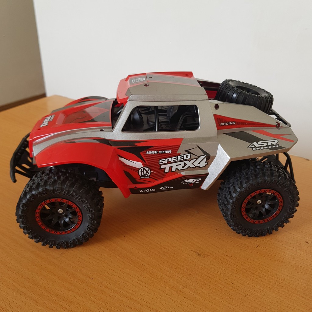 Ô TÔ ĐỊA HÌNH ĐIỀU KHIỂN TỪ XA  HIGH SPEED TRX4  MÀU ĐỎ VIỀN XÁM, TO HẦM HỐ, CHẮC CHẮN, NHỰA ABS SIÊU BỀN ,TỐC ĐỘ 30KMH