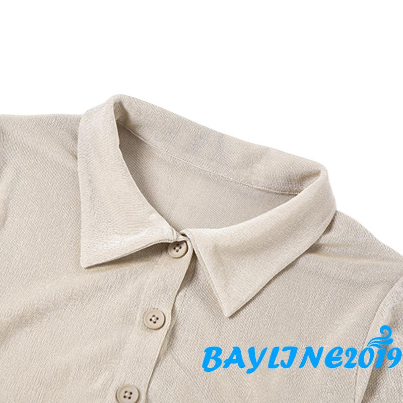 Bộ đồ hai mảnh gồm áo cổ gài nút dài tay và quần đùi cạp cao có dây rút xếp nếp mặc thường ngày cho nữ