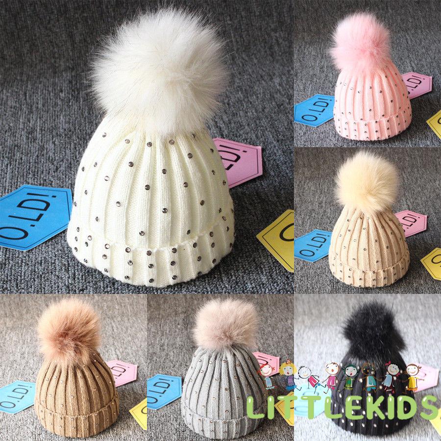 Mũ len giữ ấm đính quả bông cho bé
