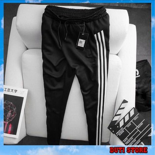 Quần thể thao nam ba sọc trắng dáng suông Duti 213