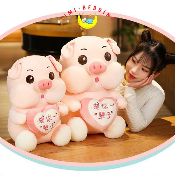 Gấu bông lợn hồng ôm trái tim cute, ngộ nghĩnh đáng yêu – Gấu bông hình con heo - Timibedding