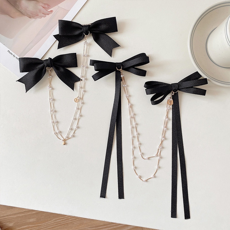 Kẹp tóc ruy băng màu đen thắt nơ phối tua rua thời trang dành cho nữ