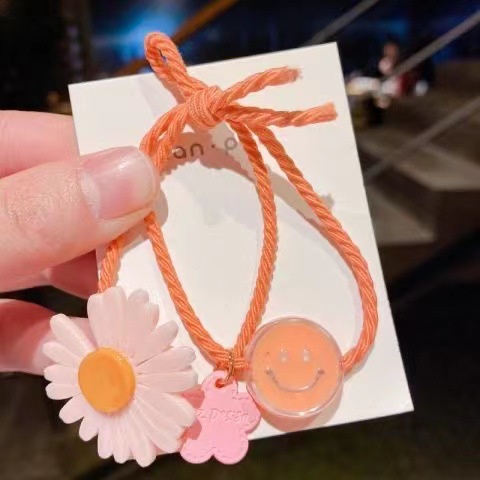 Dây thun buộc tóc đính hoa hướng dương nhỏ cho bé gái