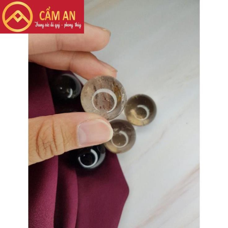 Quả cầu đá thanh tẩy tự nhiên màu vàng khói  kích thước~ 2,5cm nhỏ gọn dễ mang đi.