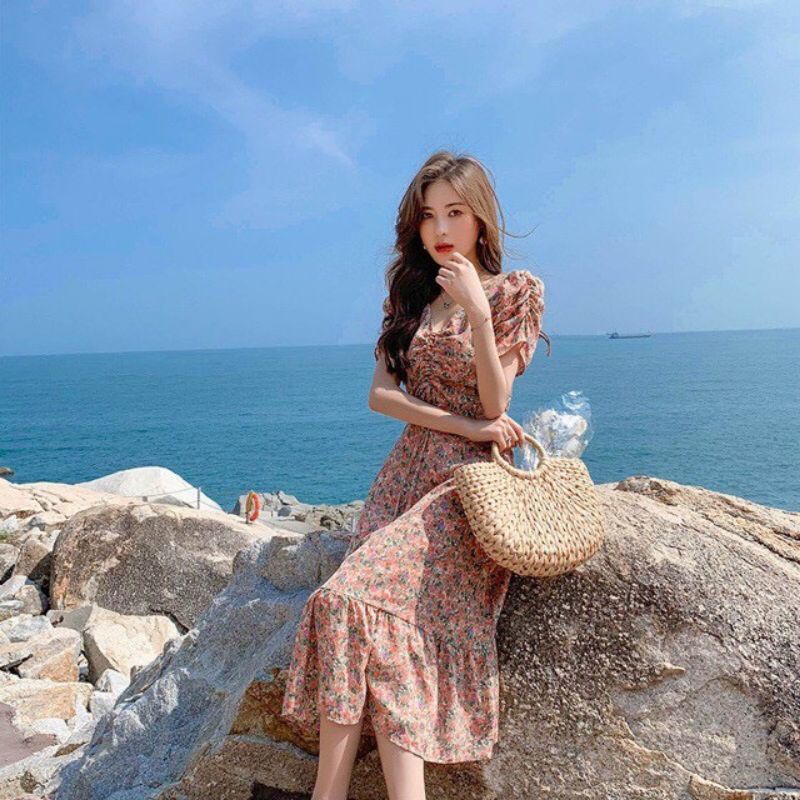 Đầm hoa rút ngực tay nhúng phồng đuôi cá.