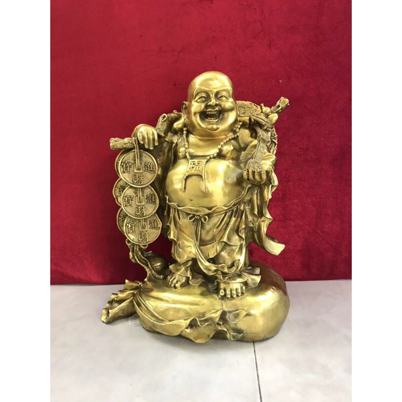 Di Lặc gánh tiền đứng trên bị