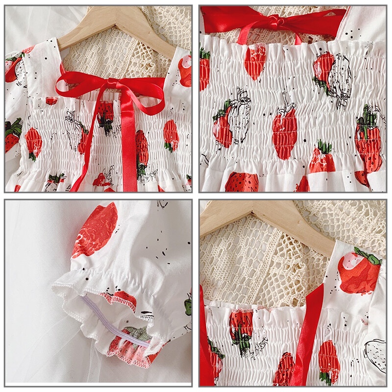 Đầm IQ ANGEL tay phồng đính nơ sau lưng họa tiết dâu tây ngọt ngào dành cho trẻ em