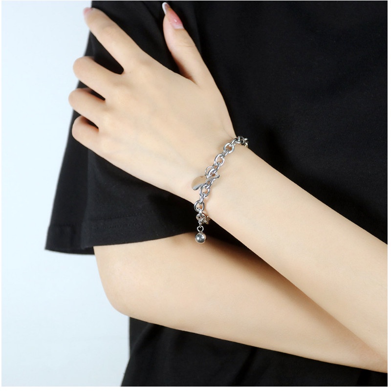 Lắc Tay Nữ Titan Ko Đen Kiểu Dây Xích Cây Đàn Và Trái Châu TT 4067