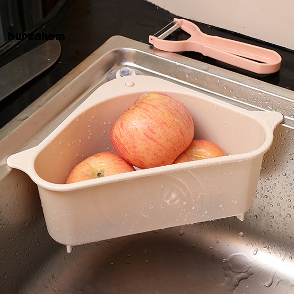 Kệ hình tam giác chất liệu bằng nhựa gắn ở bồn rửa chén đựng đồ