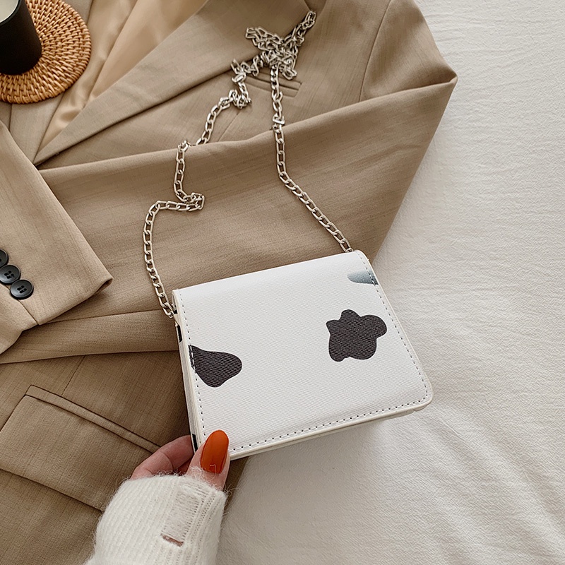 Túi xách nữ đeo chéo mini họa tiết bò sữa dây đeo chuỗi xích cá tính