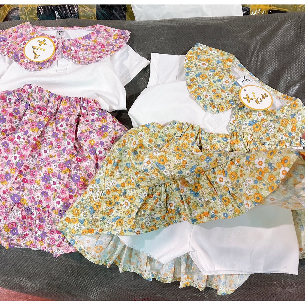 Bộ bé gái trắng cổ sen tròn hoa và chân váy đuôi cá hoa nhí liền quần XHN881