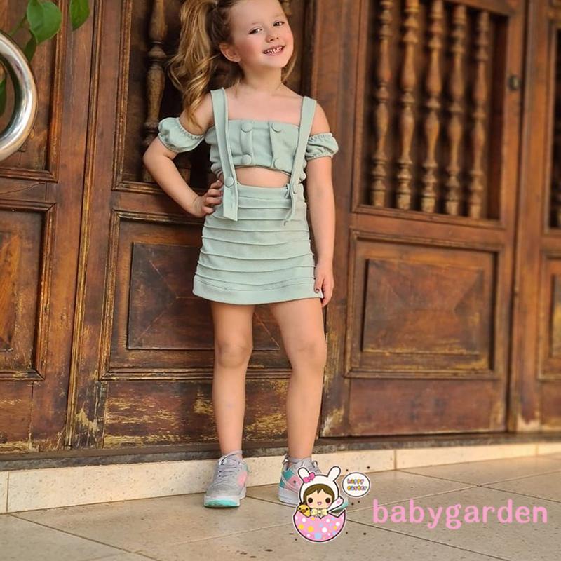 Set Đồ 2 Món Gồm Áo Croptop Tay Ngắn Trễ Vai Cài Nút + Chân Váy Yếm Có Nút Màu Trơn Cho Bé Gái 2-7 Tuổi