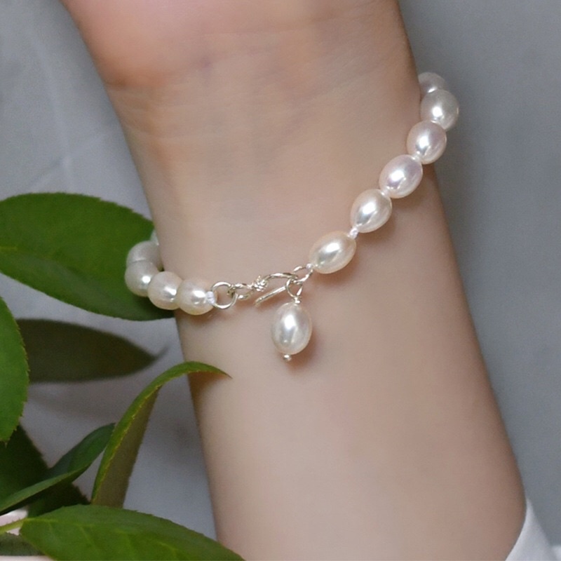 Vòng tay hạt trắng 8ly khóa bạc