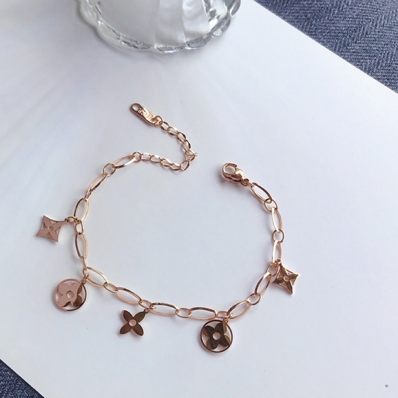 Lắc tay/Vòng tay titan hoa lv rỗng