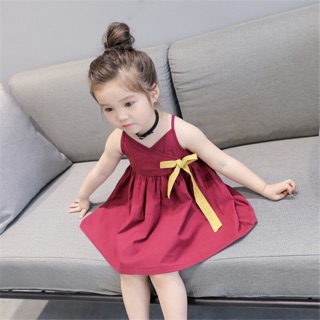 Đầm thoi 2 dây đính nơ vàng