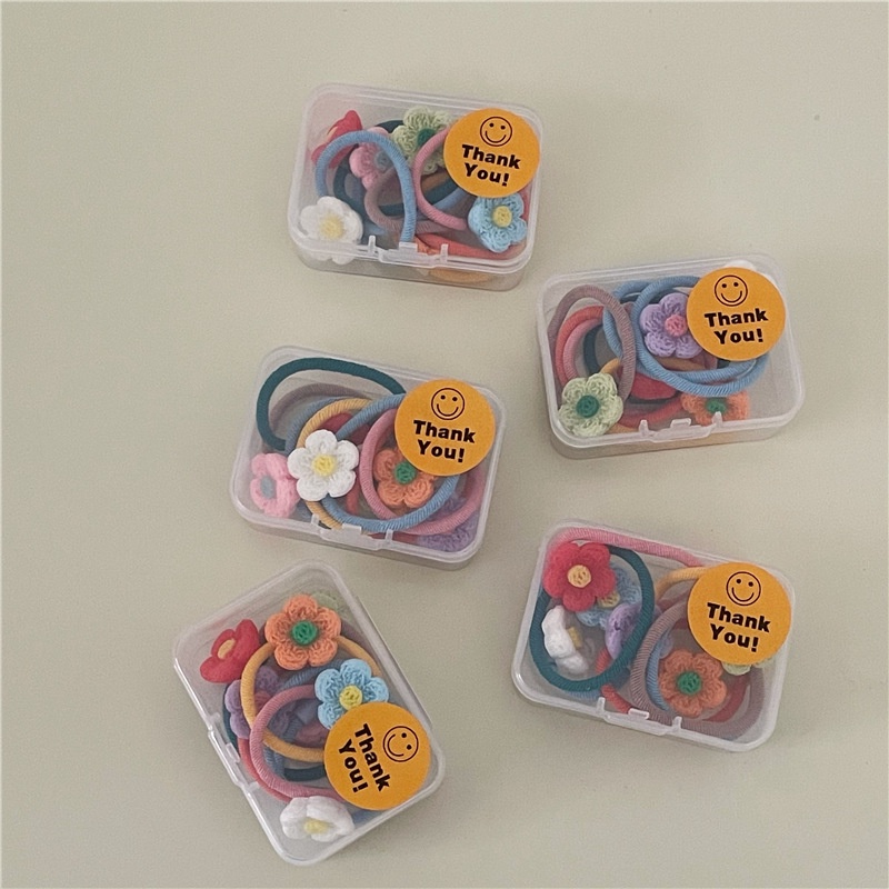 Hộp 7 chiếc cột tóc hoa nhựa nhiều màu cho bé