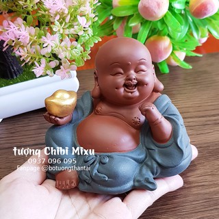 Tượng Phật Di Lặc ngồi thư thái cầm đỉnh vàng - gốm tử sa