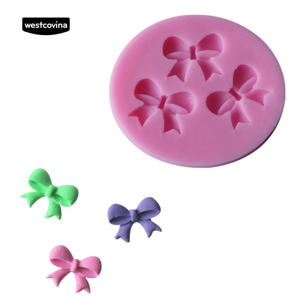 Khuôn silicone màu hồng họa tiết nơ trang trí bánh