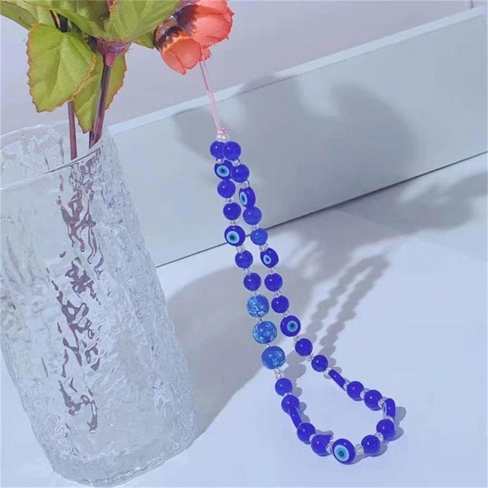Dây Đeo Điện Thoại Họa Tiết Mắt Quỷ Handmade Chống Thất Lạc