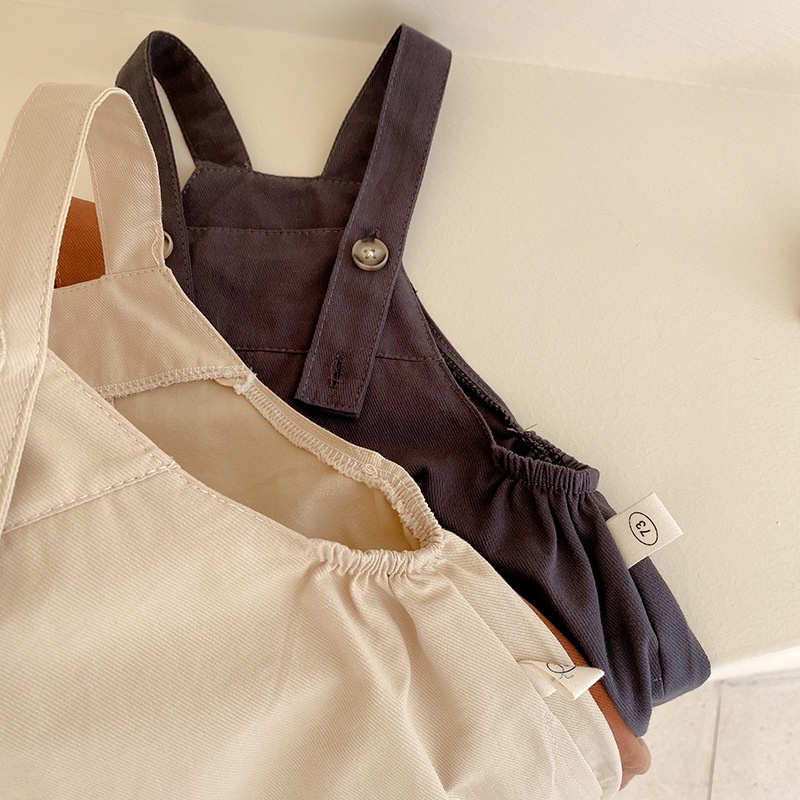 Quần yếm cho bé chất liệu vải thô khaki, có dây điều chỉnh, có túi hai bên phong cách cá tính dành cho bé từ 7-24kg