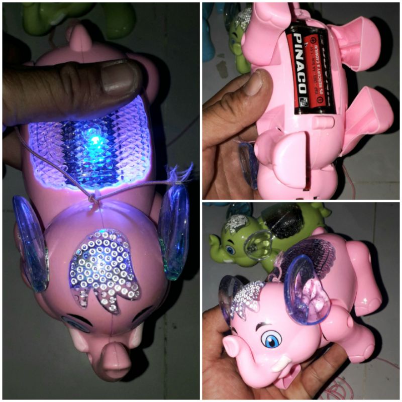 Một Chú Voi mô hình bằng nhựa chạy pin có nhạc và đèn Led rất đep_tặng kèm pin
