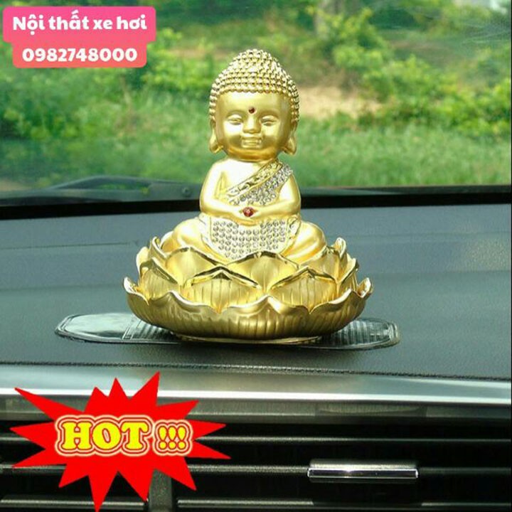 Tượng phật ông di lặc đặt taplo có quả cầu xoay năng lượng mặt trời