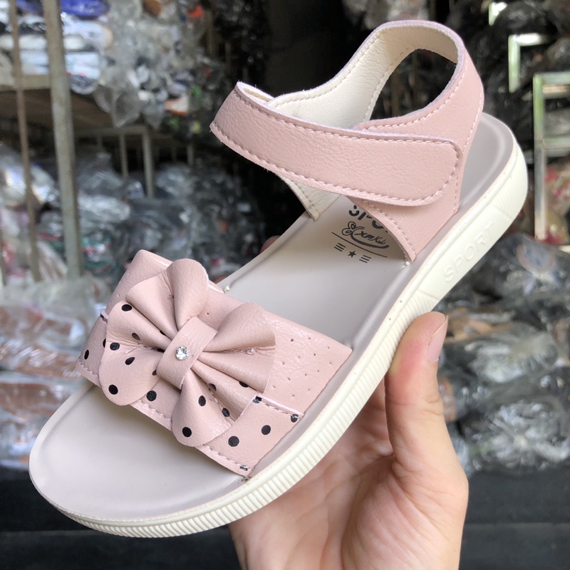 Dép trẻ em sandal bé gái hình nơ chấm bi bản ngang , quai hậu học sinh da đế cao su nhẹ xpa giá rẻ