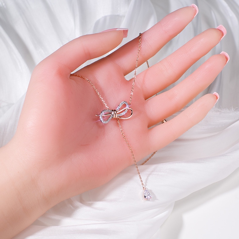 Dây chuyền thép titan mạ vàng hồng 18K hình nơ đính kim cương phong cách Hàn Quốc