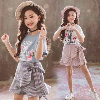 Set áo in chữ hoa và váy kiểu thắt nơ dễ thương dành cho bé gái cho bé từ 15kg - 40kg