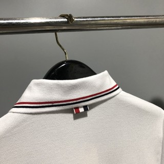 Áo polo trắng Thom Browne nam