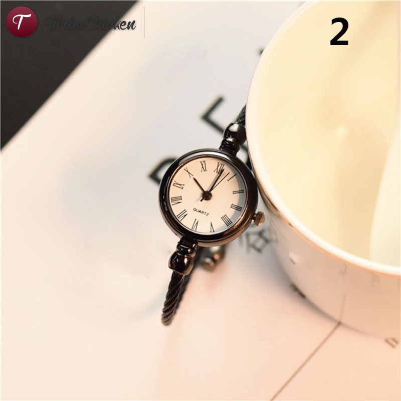 1 đồng hồ đeo tay mặt tròn mini bằng hợp kim phong cách vintage cho nữ
