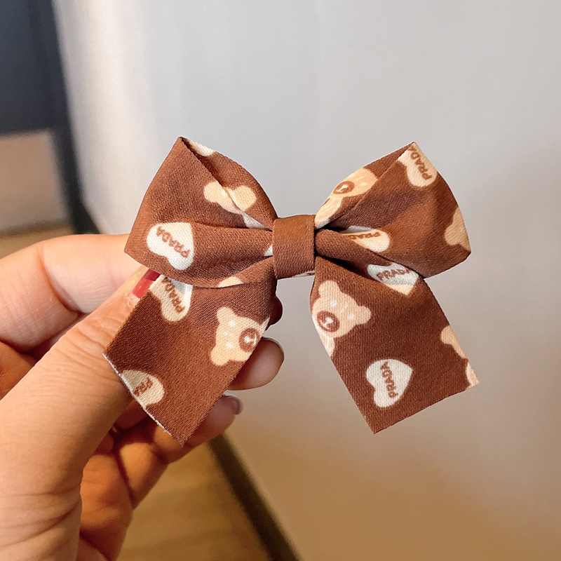 Kẹp tóc hình nơ màu đỏ sữa cà phê xinh xắn cho bé gái