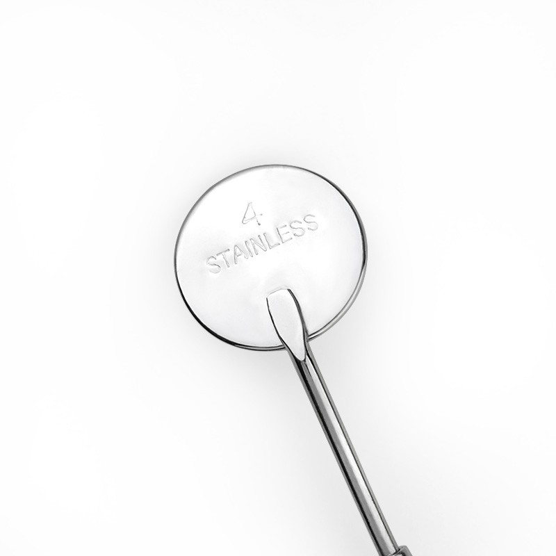 Một gương răng thép không gỉ để kiểm tra sự giãn nở lông mi bằng thiết bị in Mi-Press.