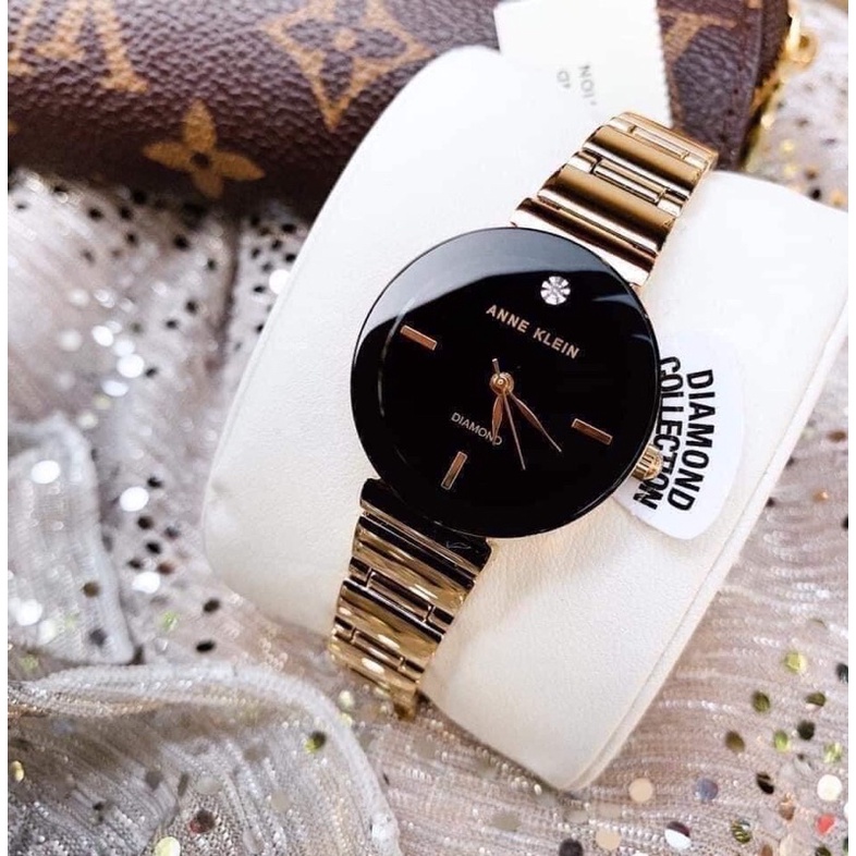 Đồng hồ nữ ANNE KLEIN model AK/2434BKGB tone vàng gold mặt đen sang trọng