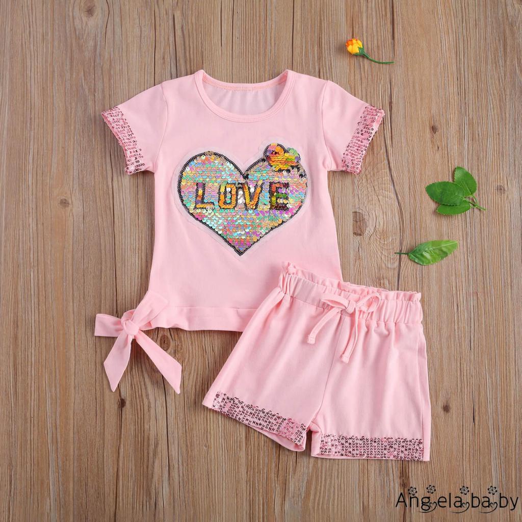 Set đồ 2 món áo thun tay ngắn cổ tròn màu trơn in hình trái tim đính kim sa + quần short lưng thun màu trơn cho bé gái