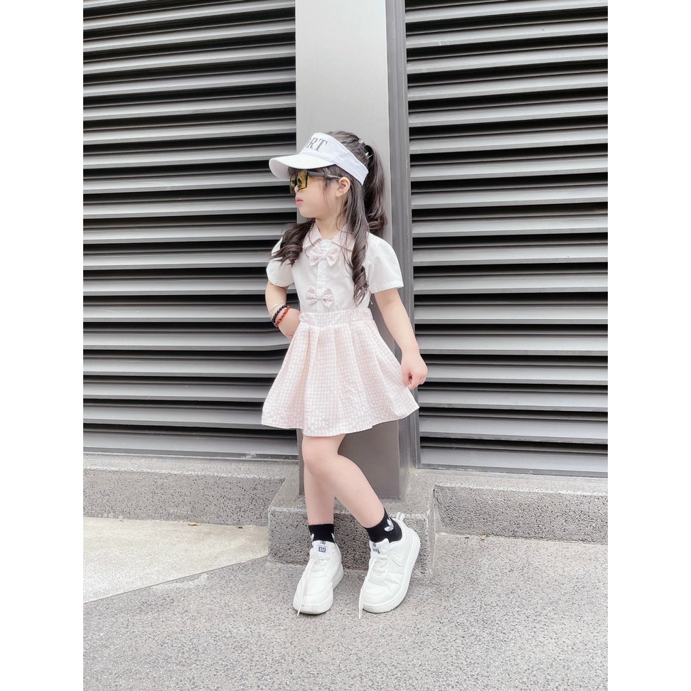 Set bé gái áo váy học sinh áo trắng cổ bẻ 2 nơ và chân váy kẻ caro liên quần XHN1002