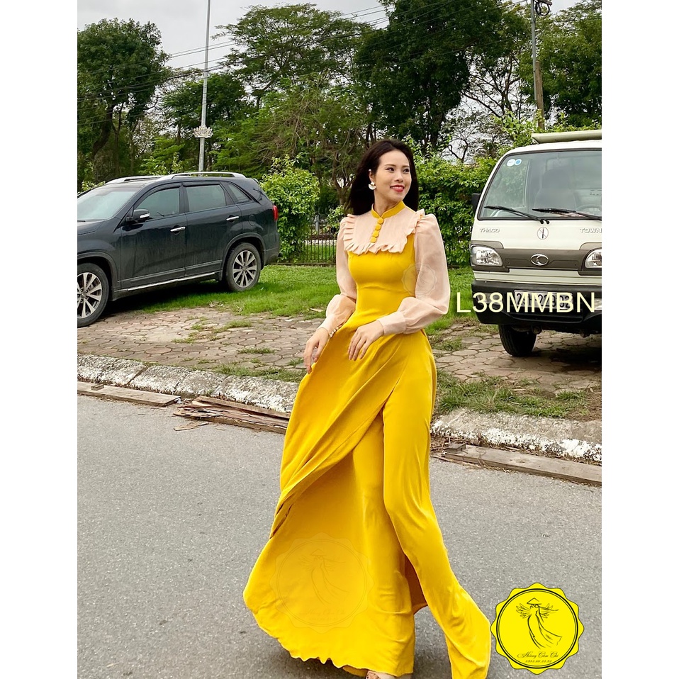 Áo dài thiết kế phối voan màu vàng vải lụa dày cao cấp, chống nhăn, co giãn tốt, tay bồng cúc bọc lụa, Hoàng Cẩm Chi