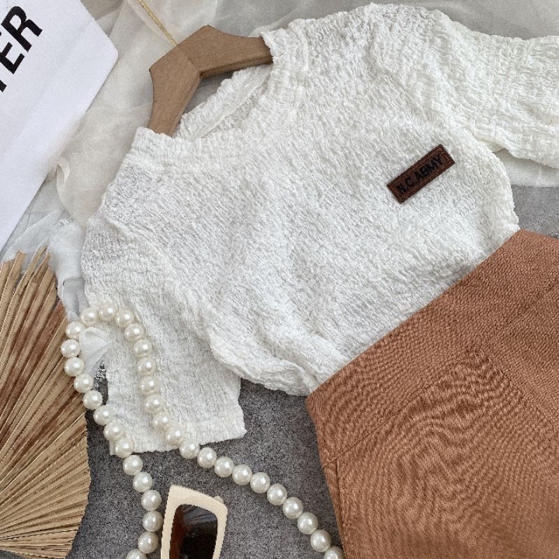 ÁO XỐP NHÚN CỔ TRÒN CHÂN VÁY CHỮ A MÀU NÂU