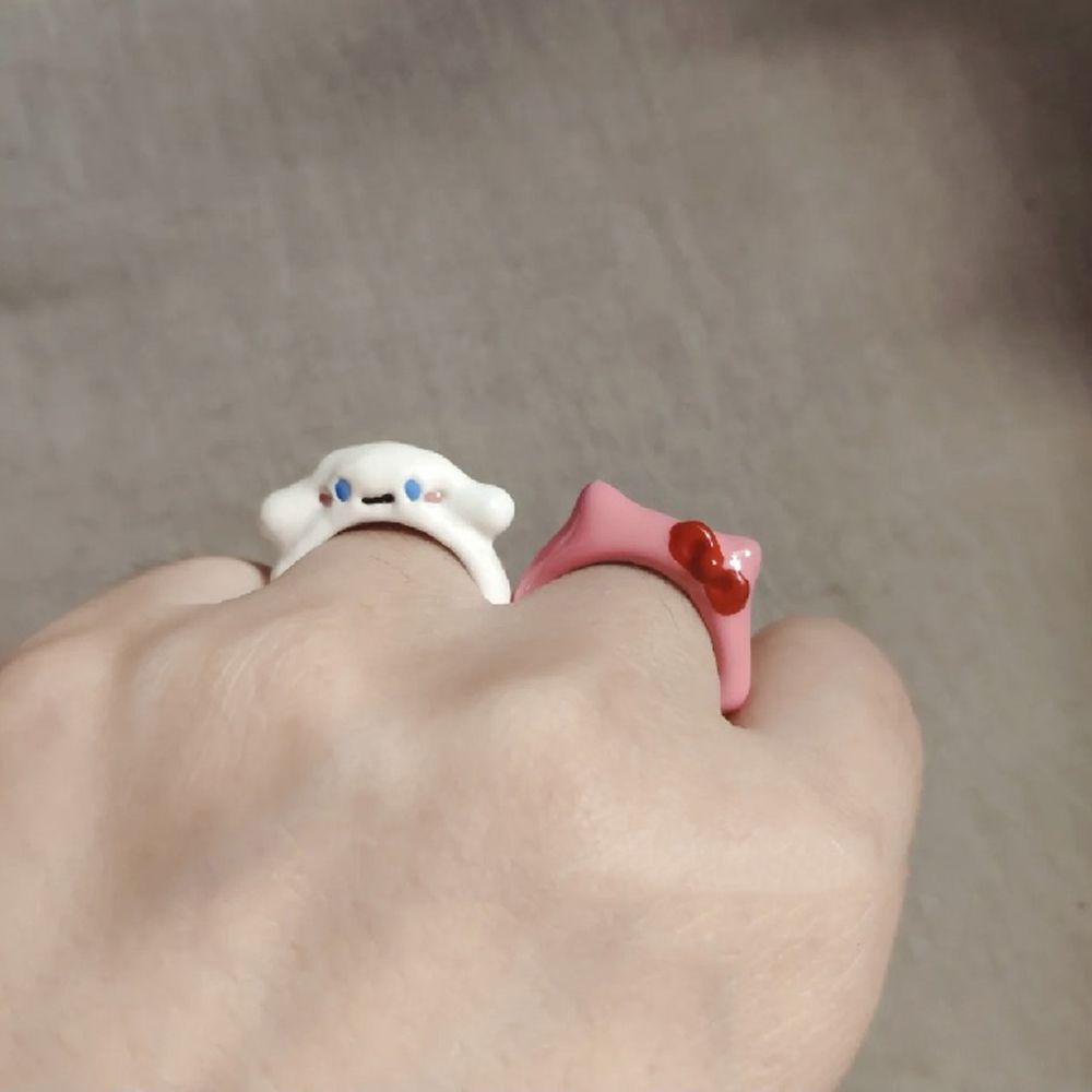 Nhẫn Hở Mặt Hình Cún Đeo Nơ Tráng Men Dễ Thương