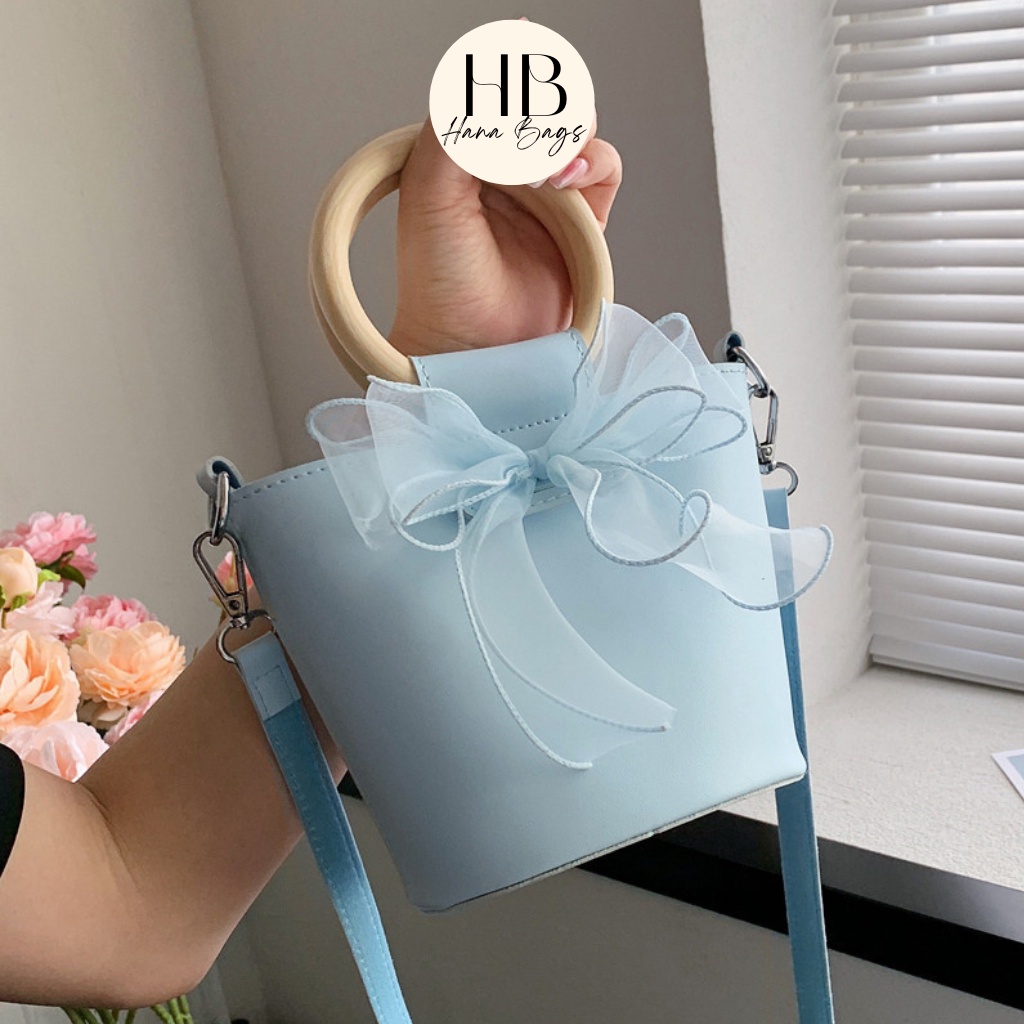 Túi xách nữ túi đeo chéo đẹp kẹp nách đeo vai da pu cao cấp giá rẻ dáng lạ tay cầm gỗ phối nơ xinh xắn TX0023 Hana Bags