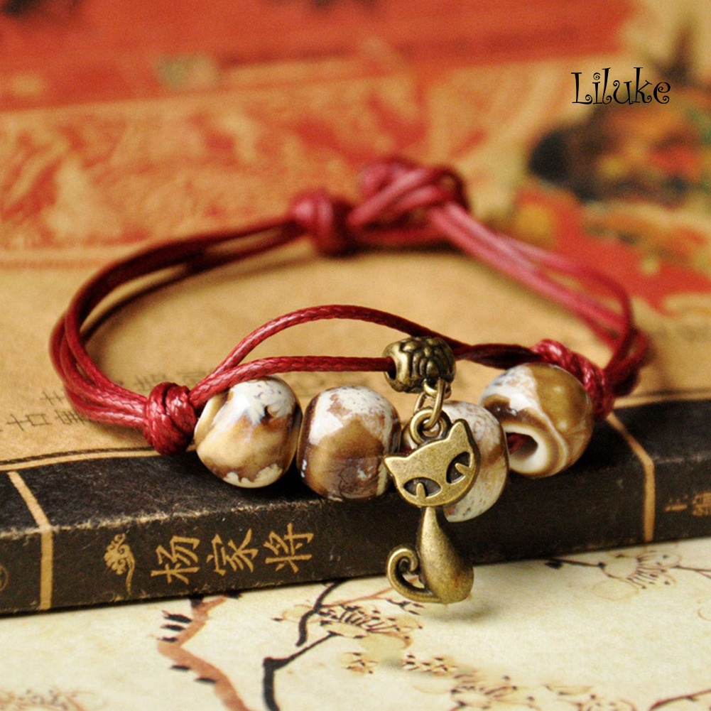 Vòng Tay Hợp Kim Trang Trí Hạt Sứ Và Hình Mèo Đáng Yêu Cho Nữ