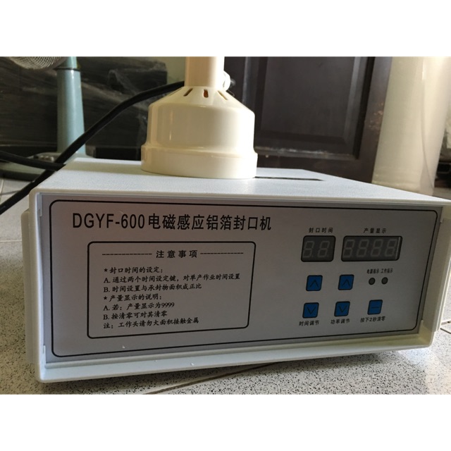 Máy dán màng seal hủ,chai,lọ ĐƯỜNG KÍNH 10CM / máy dán màng nhôm trên miệng hủ nhựa DGFY-600, Máy dán màng nhôm