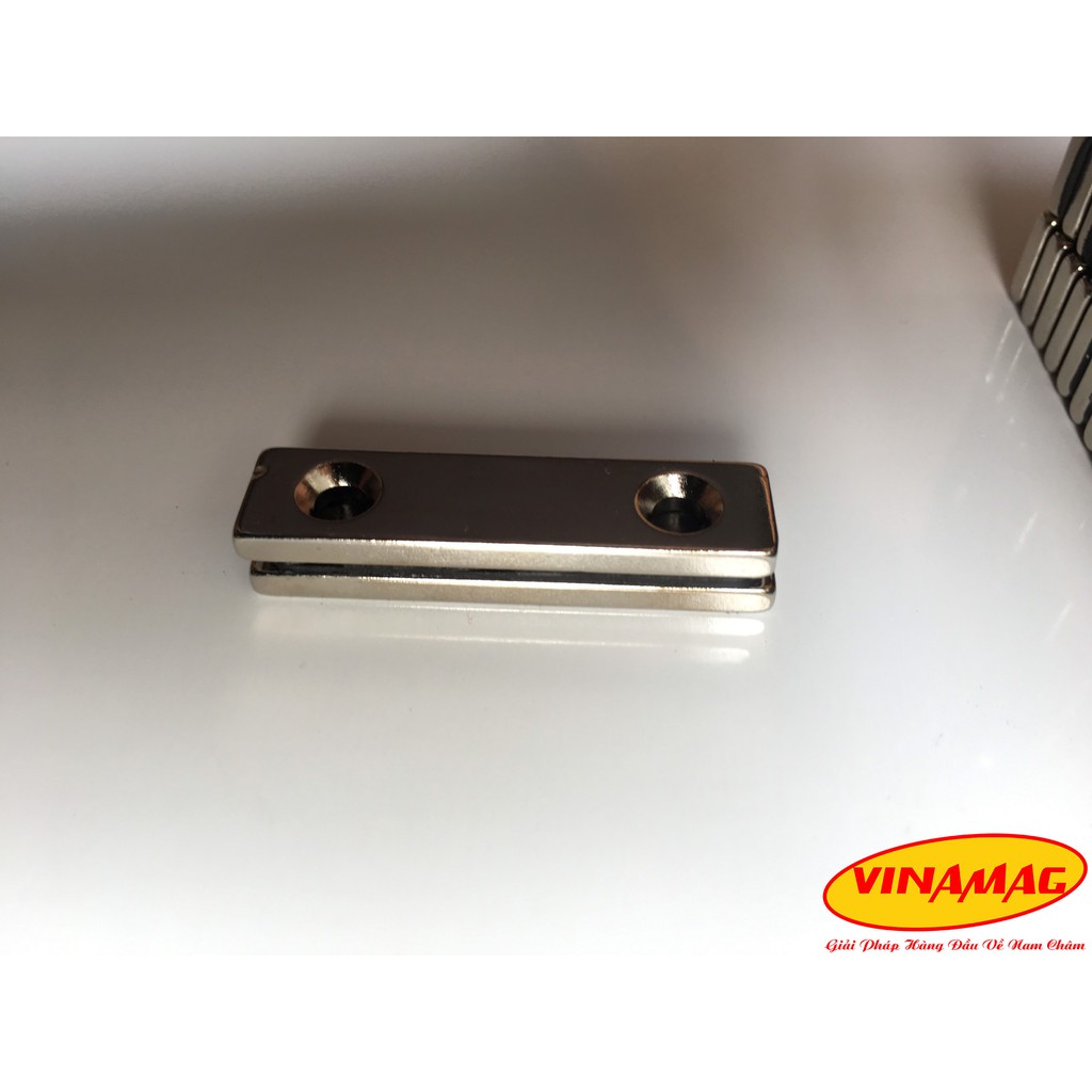Nam châm cửa gỗ, nam châm trắng hình chữ nhật có lỗ 40x10x3 có 2 lỗ vát