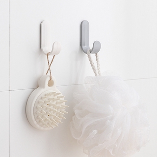 Convenient J-shaped towel rack